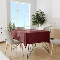 Red rugby tablecloth with gold emblem artwork on a dining table