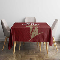 Red rugby tablecloth with gold emblem and “YOUR TEXT” over dining table