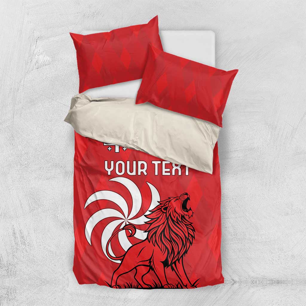 Red personalized bedding set with lion graphic, “YOUR TEXT,” and two pillowcases on a light bed