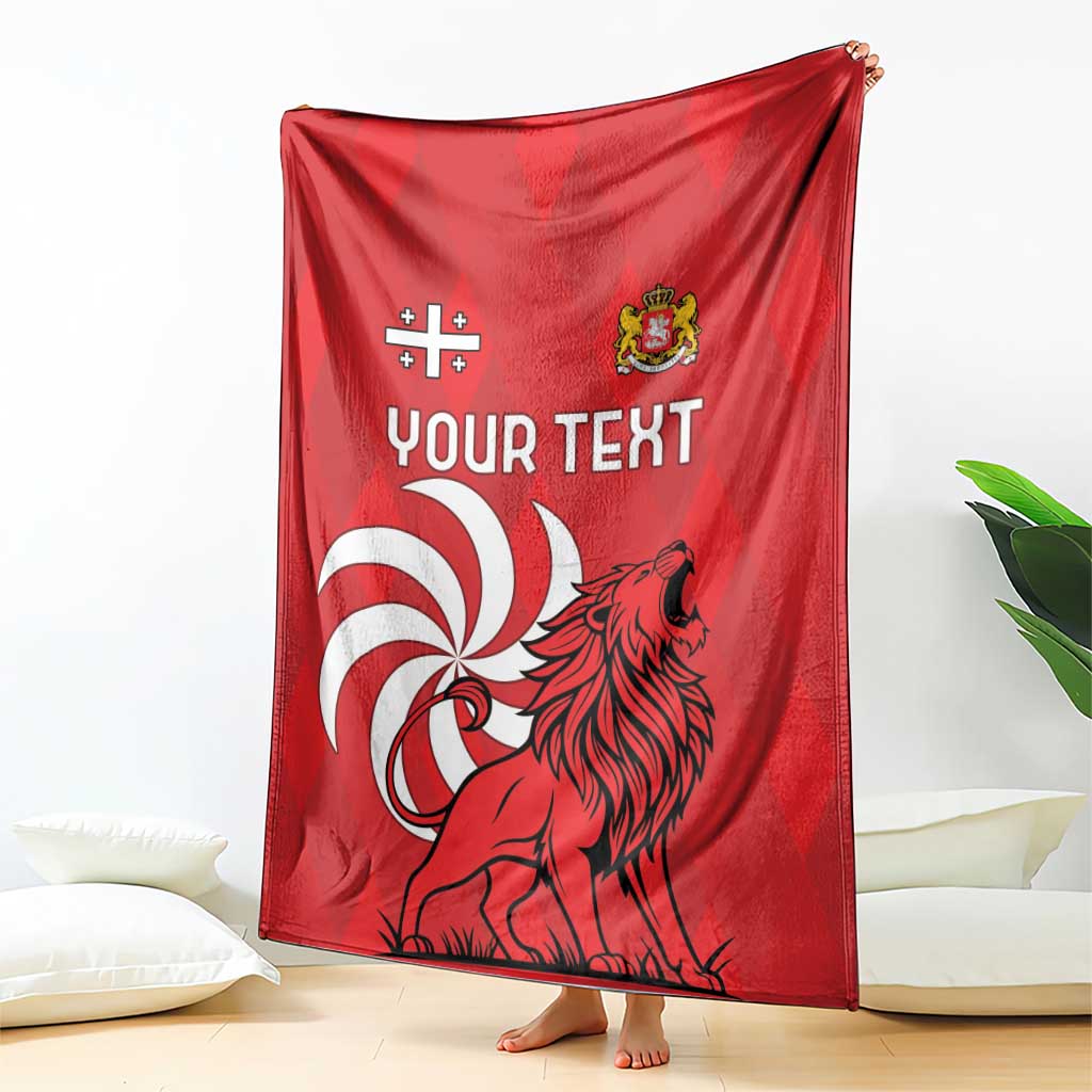 Red personalized Georgia blanket draped, showing lion graphic and "Your Text" on front