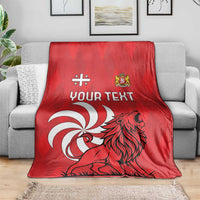 Red personalized Georgia blanket spread on a sofa with lion design and "Your Text"