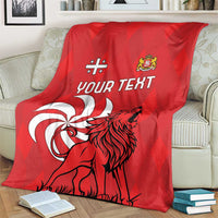 Red personalized Georgia blanket on a couch featuring lion emblem and "Your Text"