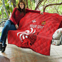 Red quilt with diamond stitching, lion graphic, crest emblem, and “YOUR TEXT”
