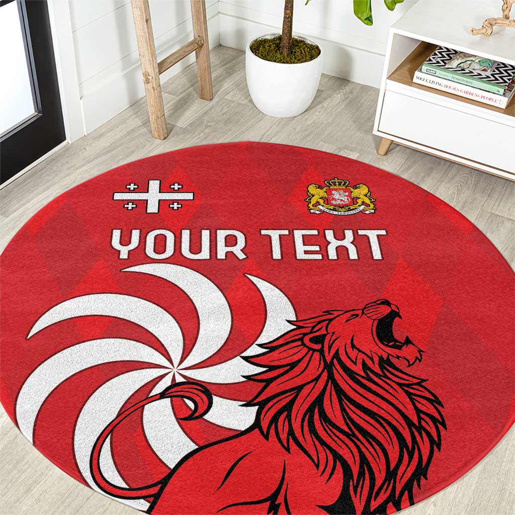 Red round area rug with lion head and crest, 'YOUR TEXT' text on red field