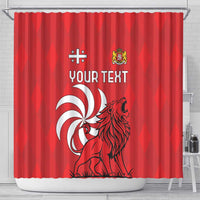 Red shower curtain hanging on metal rod with lion crest, swirl logo, and YOUR TEXT