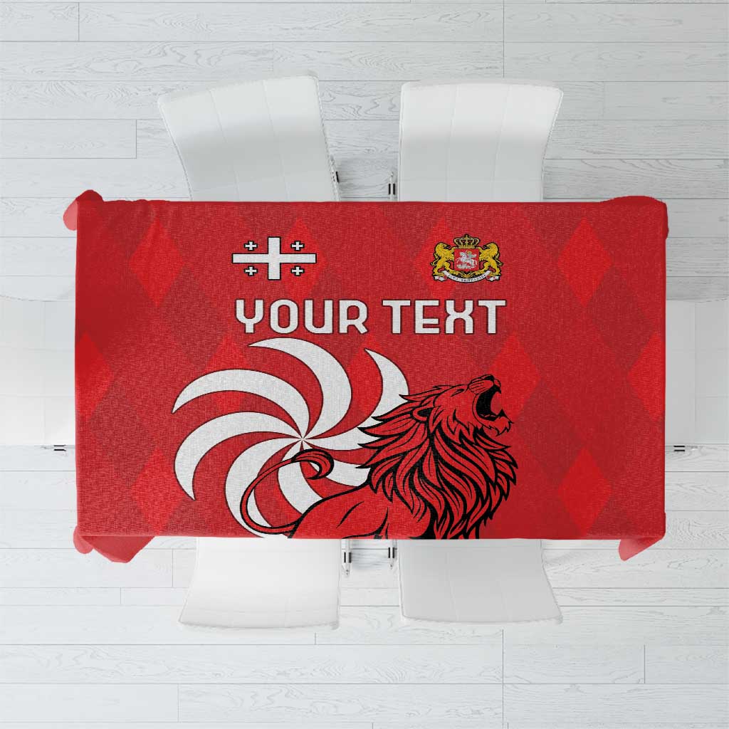 Red tablecloth with lion crest and placeholder 'YOUR TEXT' print