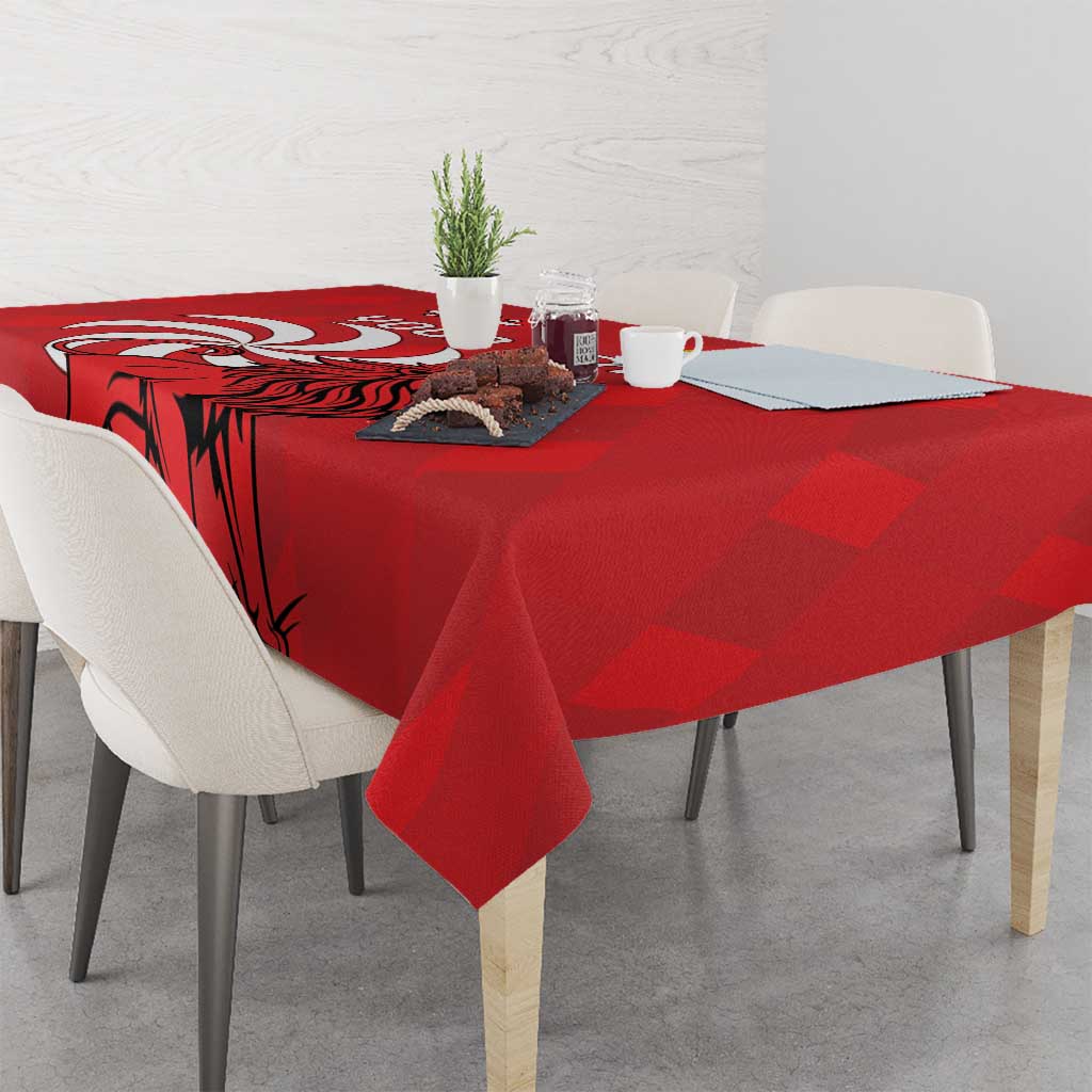 Red tablecloth with lion graphic, corner drape over dining table