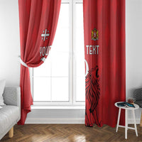 Red window curtain with lion crest and “TEXT” text graphic, draped beside window