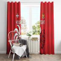 Red curtains with top hooks and lion crest with “TEXT” graphic, room corner view
