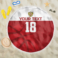 Red round beach blanket with white fringe, crest, custom text and number 18
