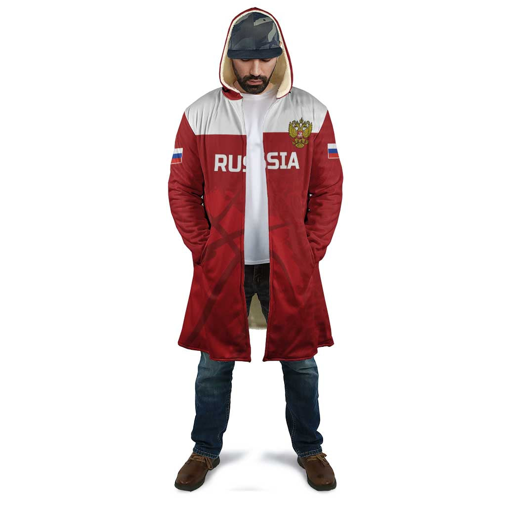 Red and white hooded basketball cloak worn by a man, Russia text and crest