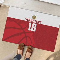 Red custom basketball doormat with white stripe, crown emblem, and number 18 near shoes