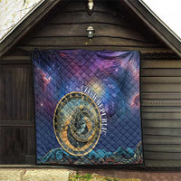 Purple and blue quilt hanging outdoors with gold astronomical clock emblem and wave detailing