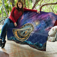 Purple astronomical clock quilt held up indoors with gold emblem and starry space colors