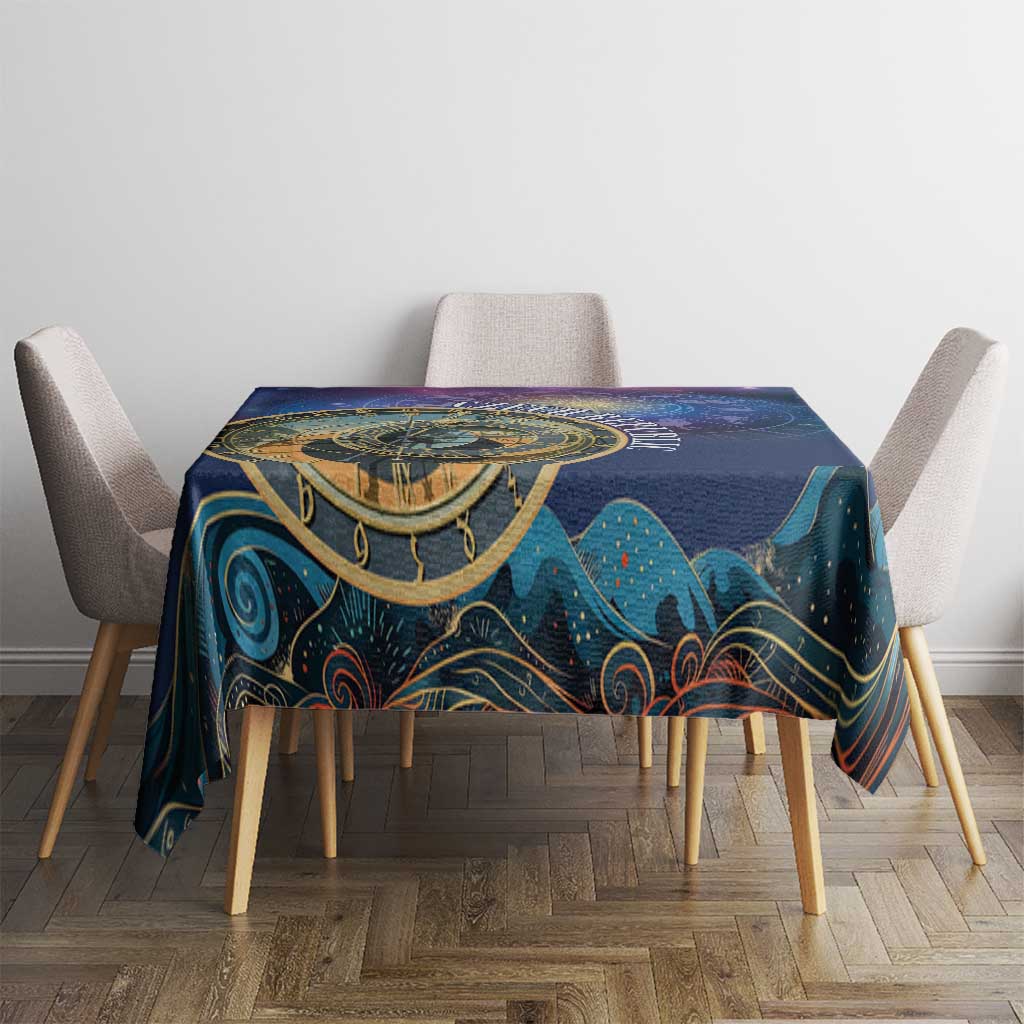 Purple space tablecloth on dining table, gold zodiac design and teal mountain motifs