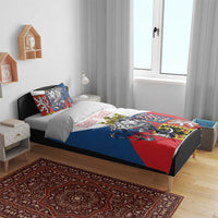 Personalized bedding set on bed with lion crest duvet and two matching patterned pillows.