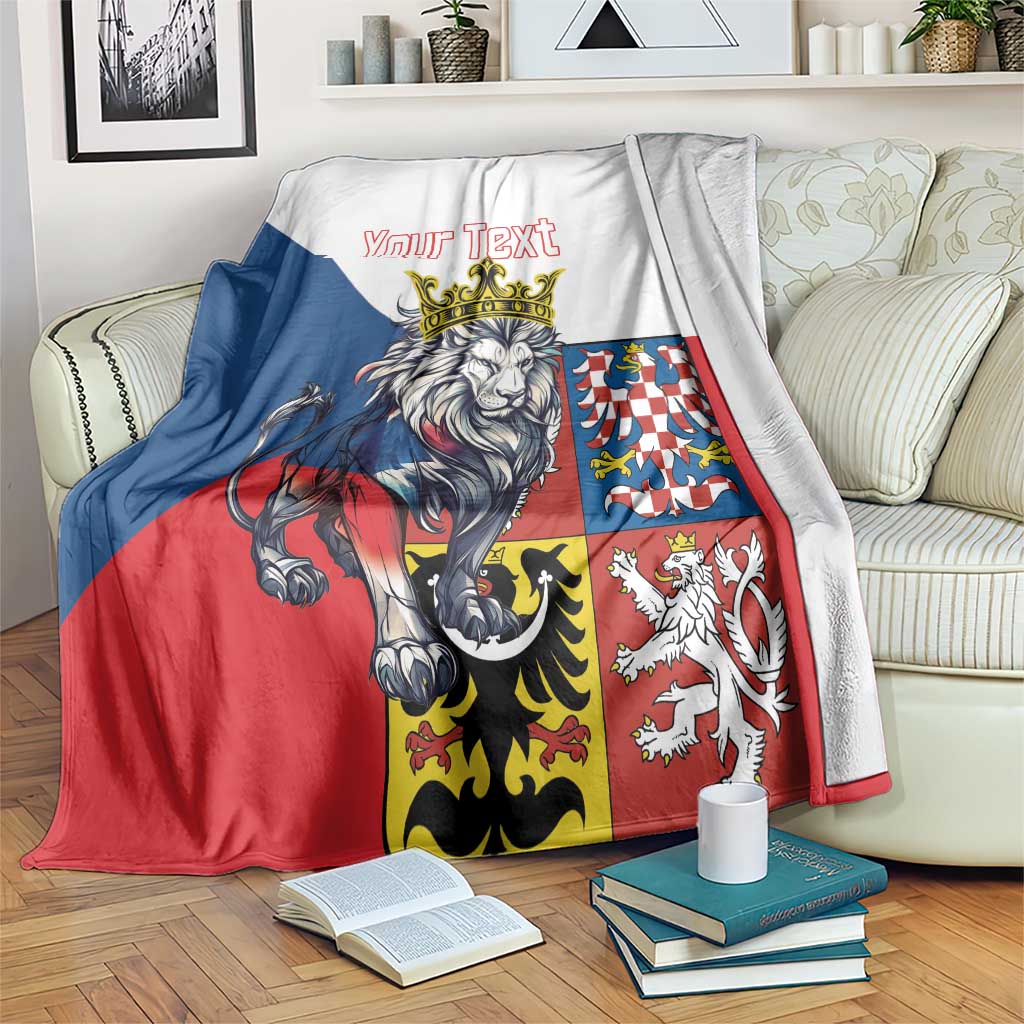 Personalized lion crest blanket with red, blue, and black paneling and “Your Text”