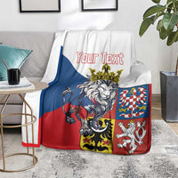 Personalized lion crest blanket on living room chair with “Your Text” and coat-of-arms