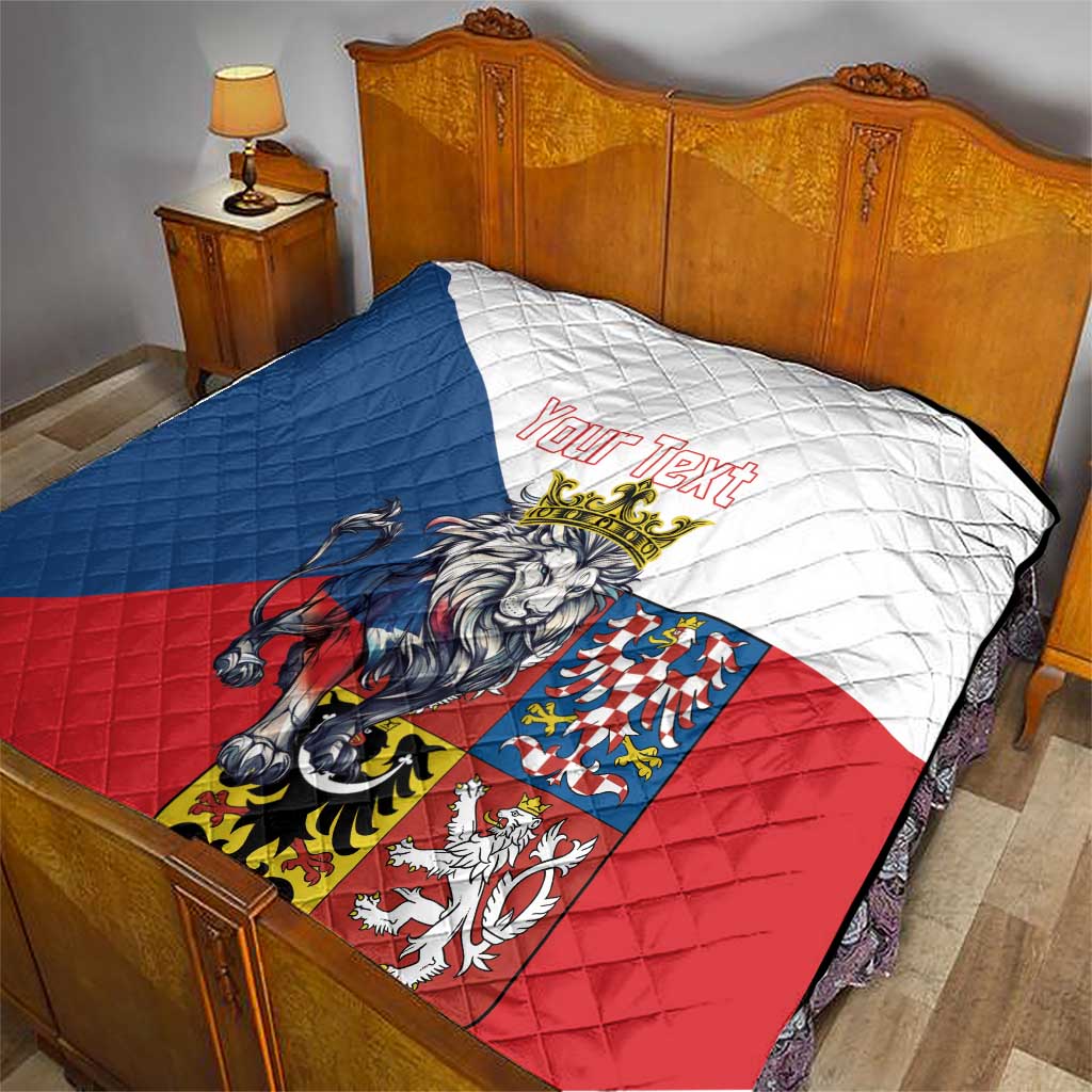 Personalized quilt laid on a bed; crowned lion graphic on blue, white, and red sections.