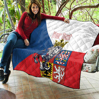 Personalized quilt held outdoors; blue, white, and red panels with crowned lion and text.