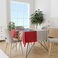 Red tablecloth with lion crest stripe insets, hanging evenly on the dining table