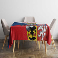 Red tablecloth with multicolor lion and shield stripe panel centered on the table