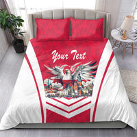 Red and white duvet cover with eagle and city scene, chevron stripes, plus two red pillows