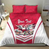 Red and white duvet cover and pillows with eagle, city scene, and “Your Text” lettering