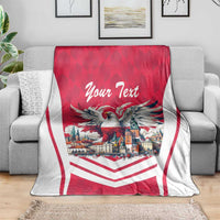 Personalized eagle throw blanket on sofa in red with white chevrons and “Your Text”