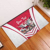 Red and white rubber doormat with white-tailed eagle emblem and custom text, corner view
