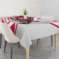Personalized tablecloth on dining table with red-and-white geometric chevrons and eagle print