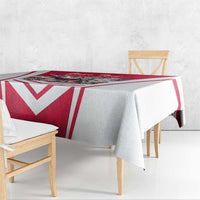 Red and white personalized tablecloth with chevron stripes and eagle artwork over bench table