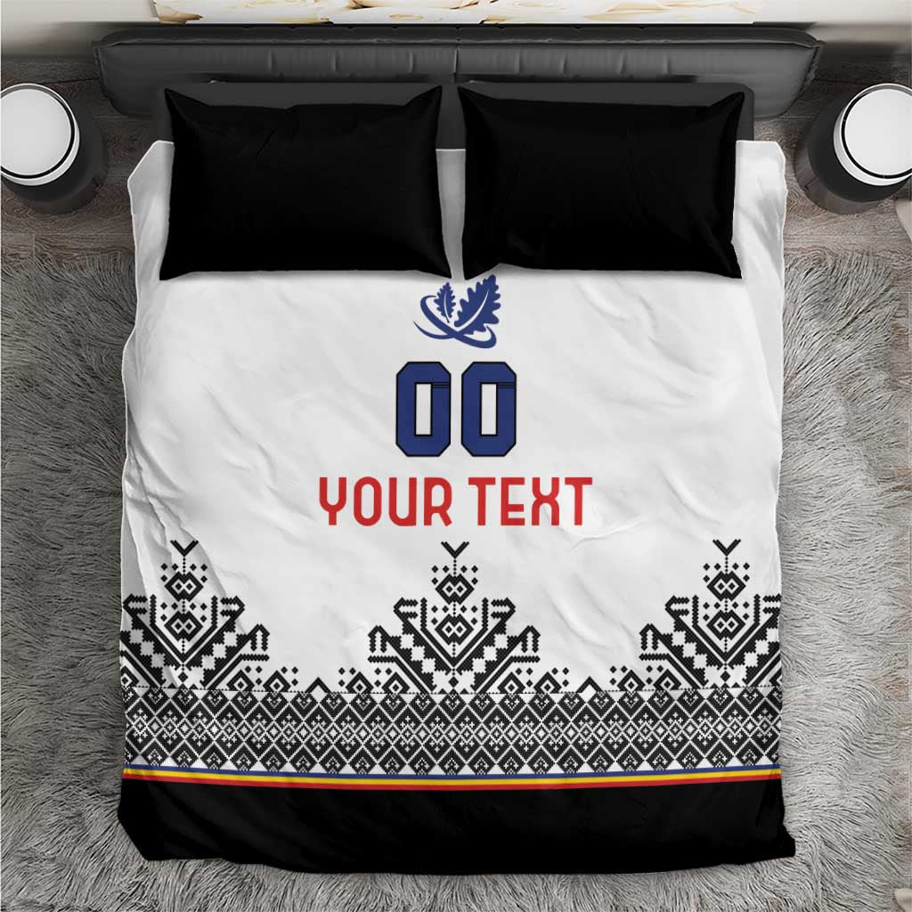 White duvet with blue crest, '00' and red 'YOUR TEXT', black Nordic stripe border, two black pillows