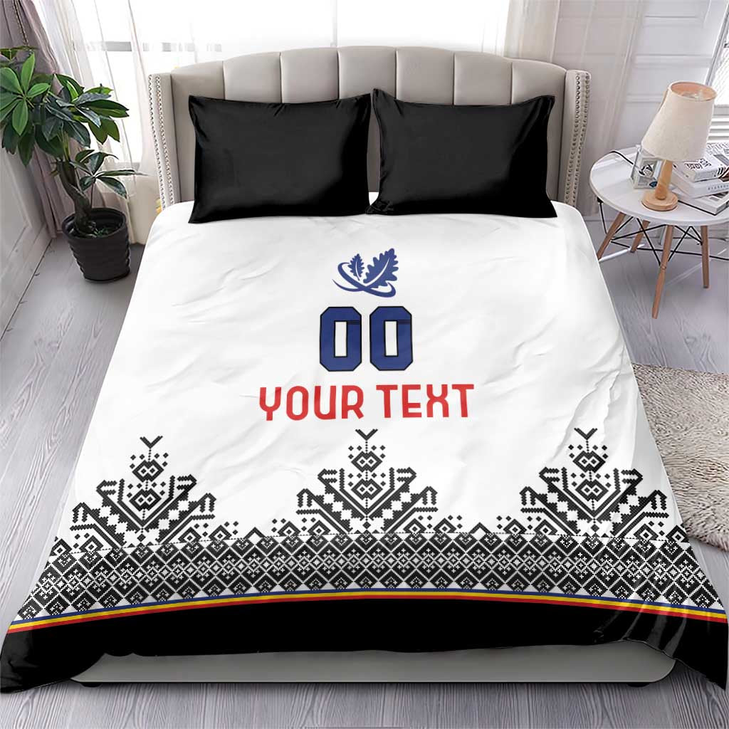 White bedding set with black Nordic trim, blue crest, '00' and red 'YOUR TEXT', black pillows