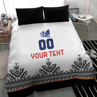 White duvet cover with blue crest and '00', red 'YOUR TEXT', black Nordic pattern band, black pillows