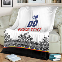 Draped white blanket with blue crest and 00, red YOUR TEXT, black patterned hem and stripe