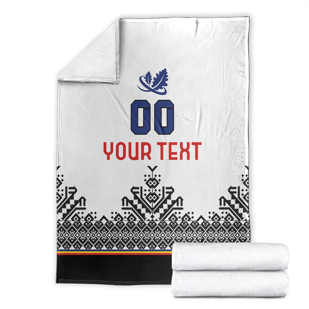 Folded white blanket with blue crest, 00, red YOUR TEXT, black patterned band and stripe