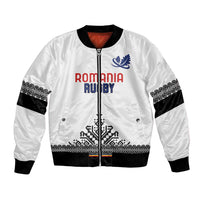 White rugby bomber jacket with full zip, black ribbed cuffs, and blue crest graphic