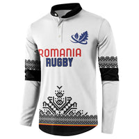 White rugby button sweatshirt with Romania Rugby front text, blue leaf and geometric stripe hem