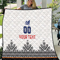 White quilt with diamond stitching, blue crest 00, red YOUR TEXT, black patterned border