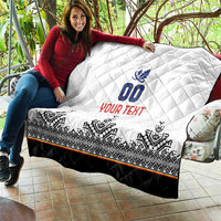 White quilt held outdoors showing blue 00 crest, red YOUR TEXT, black bottom border
