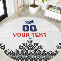 Round white rug with blue icons, red “YOUR TEXT,” and black geometric border