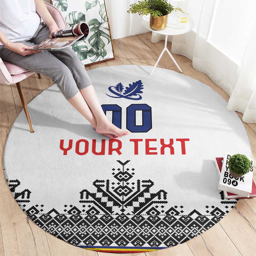 Round white rug showing “YOUR TEXT” in red with blue symbols and black pattern