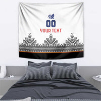 White custom tapestry with blue crest, red “YOUR TEXT”, and black-and-white patterned hem.