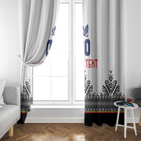 White window curtain pair with blue number motif and black patterned bottom band.