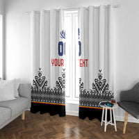 White window curtain panels with blue crest and custom text over black geometric band.