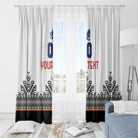 White window curtain panels with blue crest, custom text, and black patterned valance.
