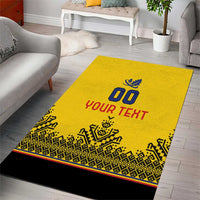 Yellow area rug featuring rugby ball crest, 'YOUR TEXT', and black geometric trim