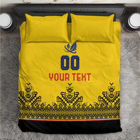Yellow rugby bedding set laid flat: 00 emblem above YOUR TEXT with patterned hem