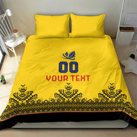Yellow duvet and pillow set with blue 00 logo, YOUR TEXT, and tribal-pattern stripe
